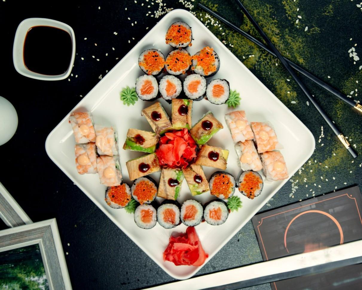 Overhead sushi platter with soy sauce